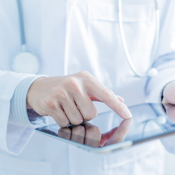 Doctor working on a digital tablet